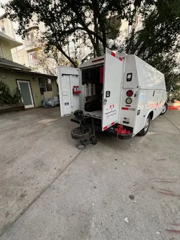 Magnet Plumbing service vehicle on-site for Grease Trap Cleaning in Laguna